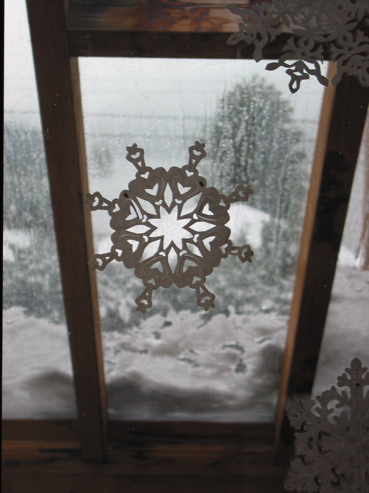 A paper snowflake echoes the outside